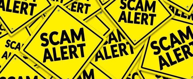 A group of yellow and black scam alert signs on a yellow background, warning Amazon users of potential fraudulent activity.