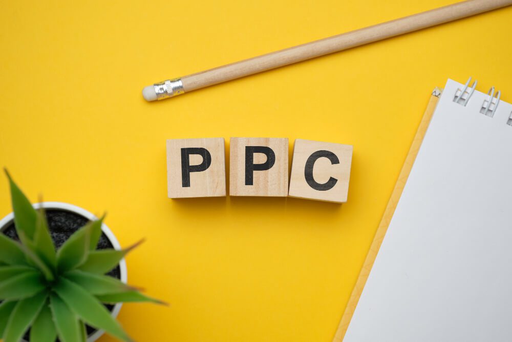 The word ppc spelled out on a yellow background with Amazon.